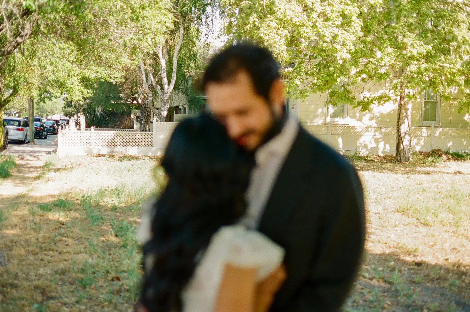 A couple hugging in blurry wedding photos