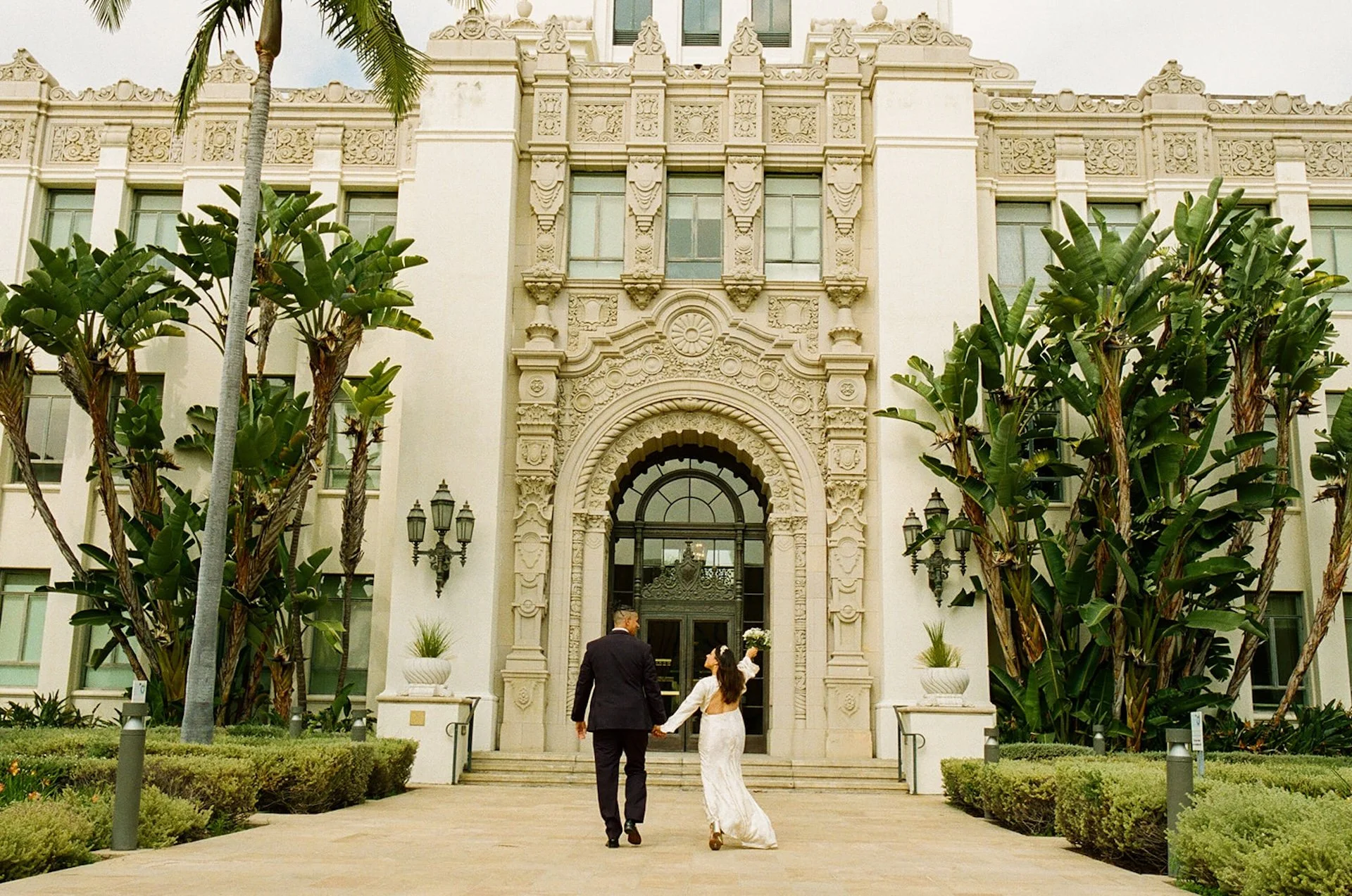 Couple walking into the Beverly Hills Courthouse for their elopement