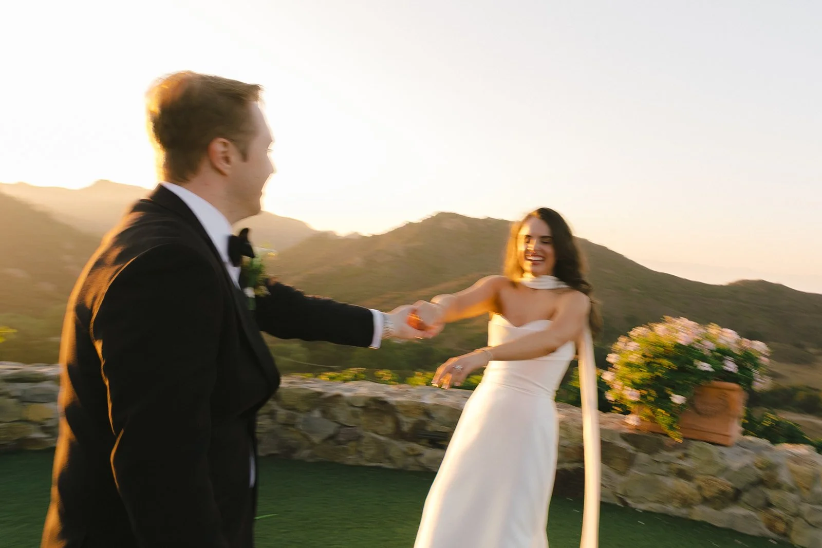 A couple dancing at sunset