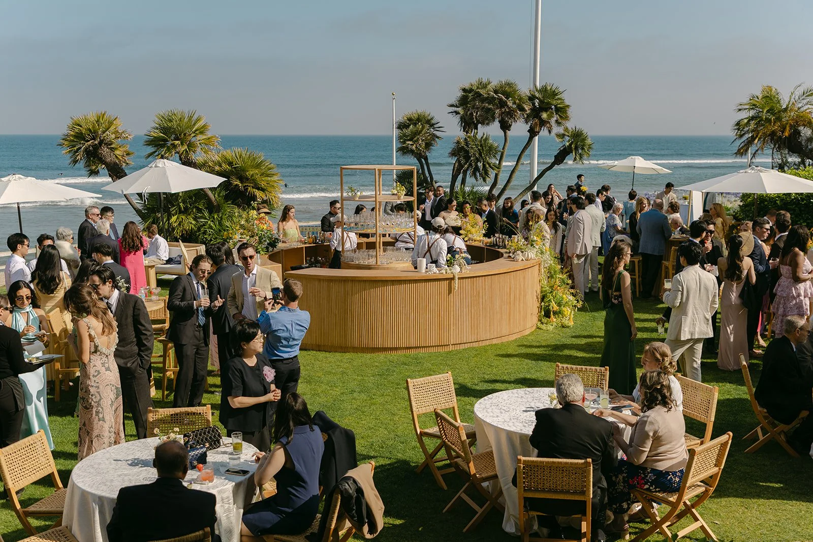 Wedding guests at a cocktail hour at Adamson House