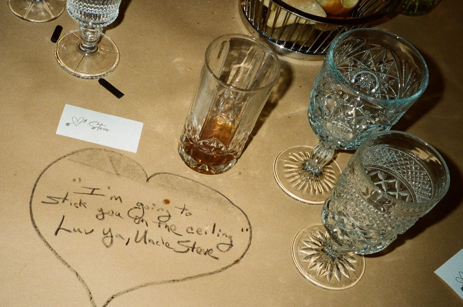 A sweet message written to the bride and groom on the kraft paper tablecloth