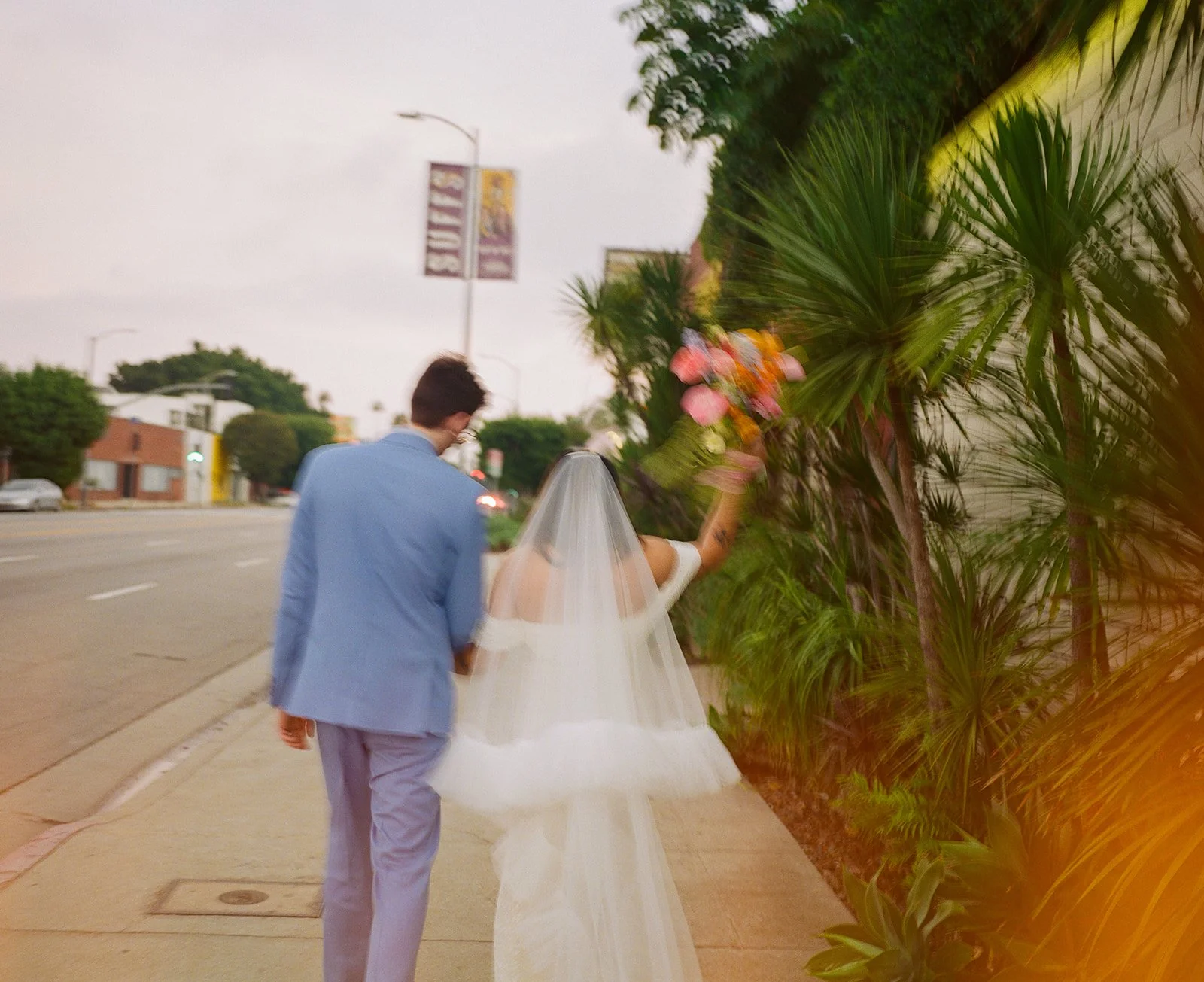 A blurry wedding photo of a bride and groom in LA