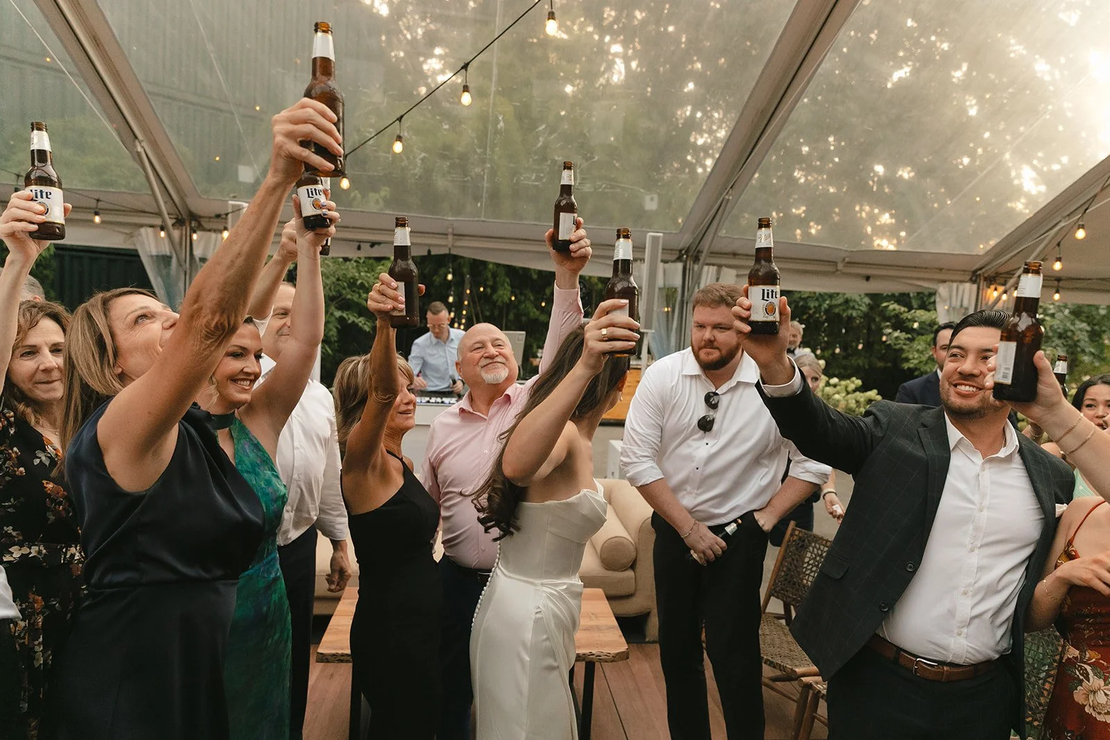 A memorial idea for wedding where guests are cheersing for the bride's dad