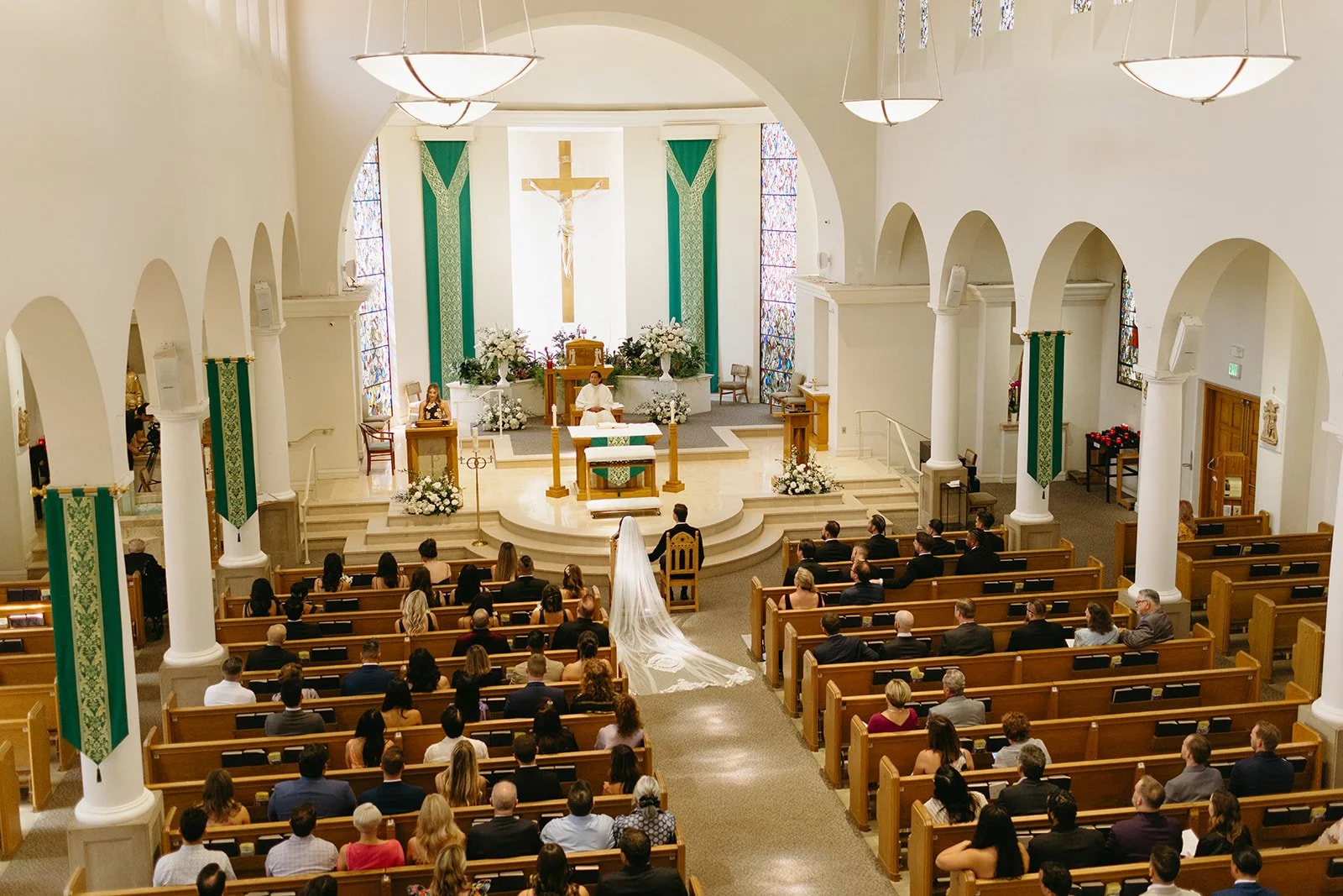 A wedding ceremony taking place inside of a church wedding venue in LA