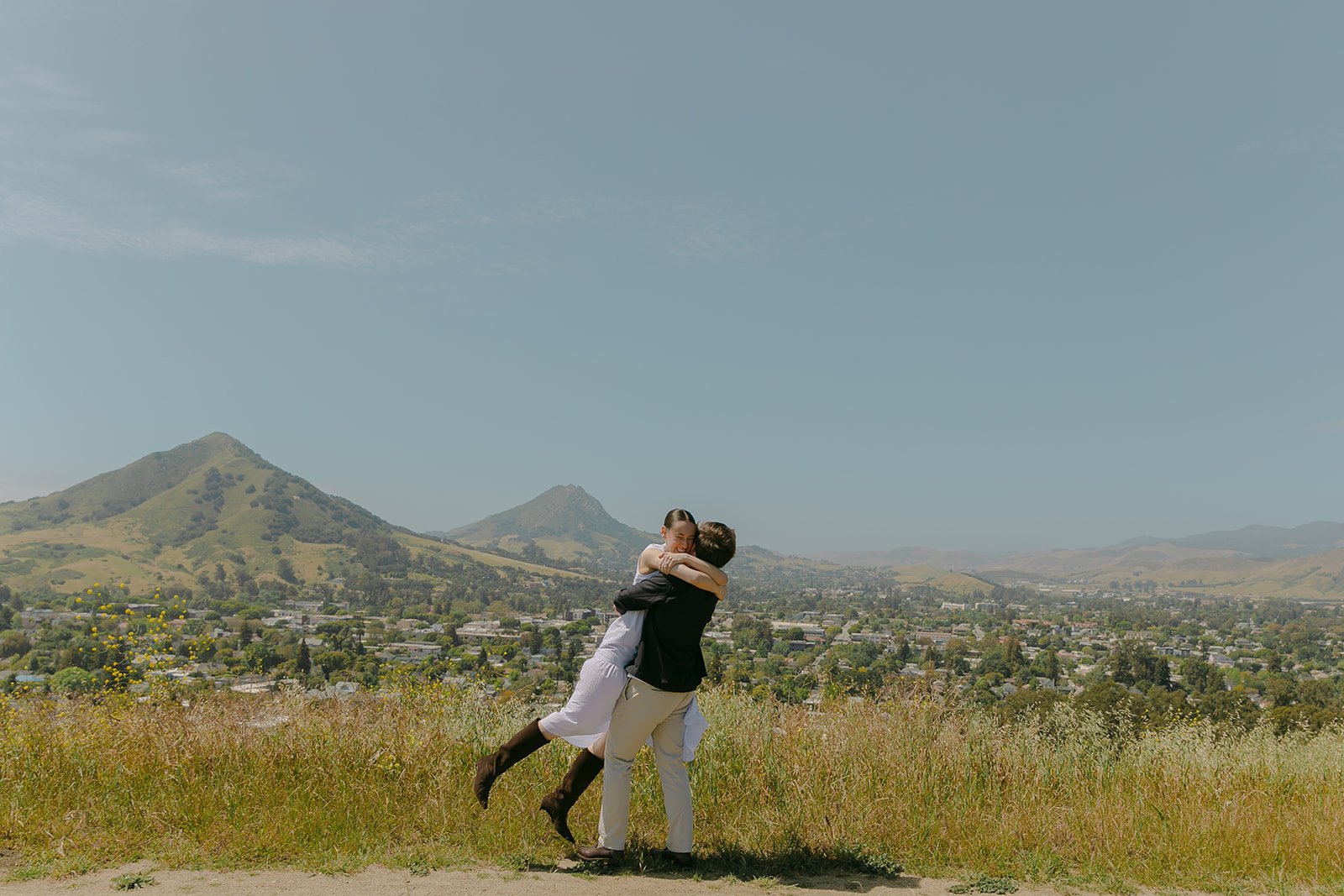 A couple taking  SLO engagement photos on Terrace Hill