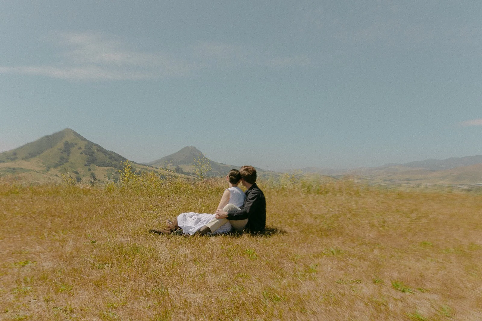A couple taking San Luis Obispo engagement photos on Terrace Hill