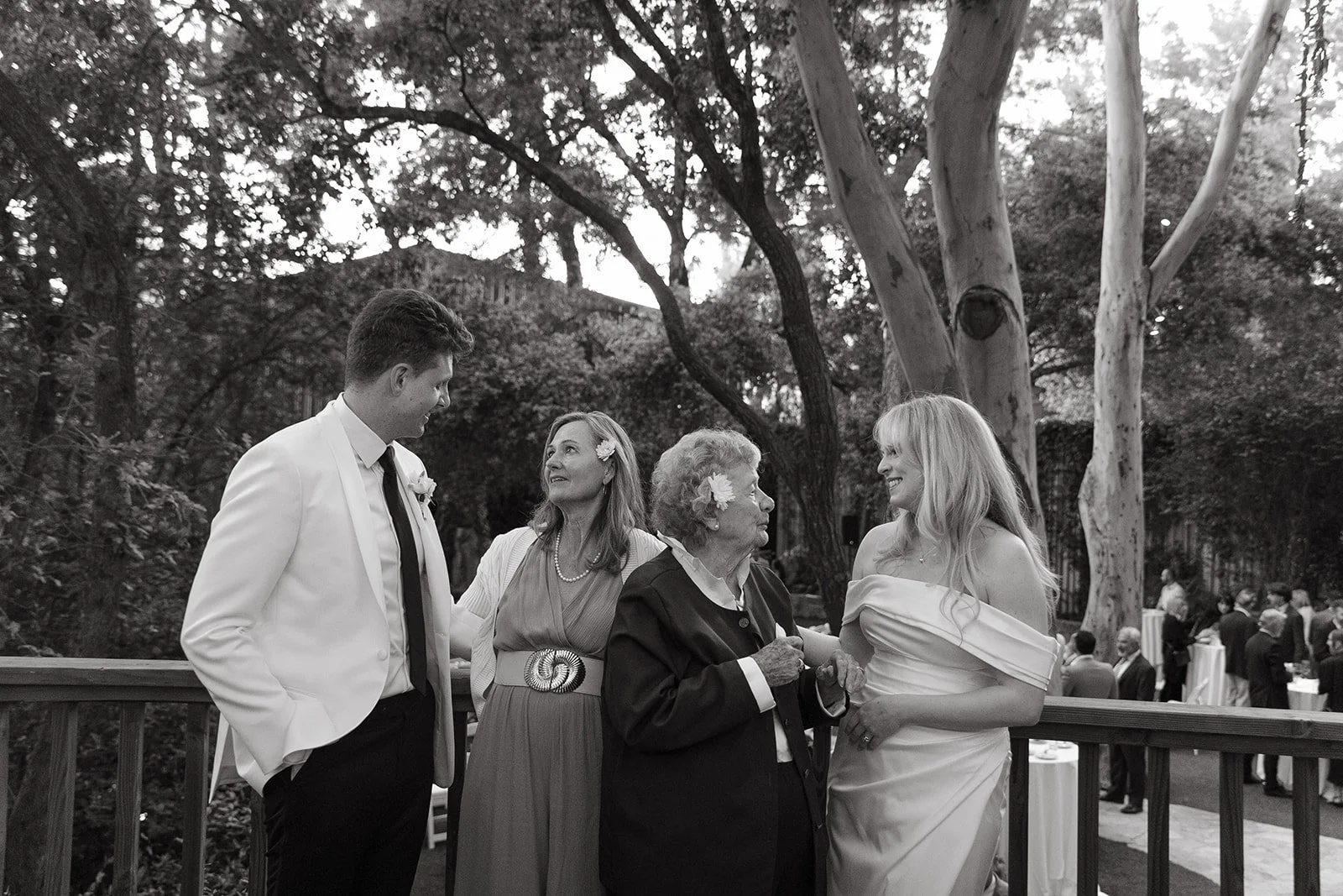 A bride and groom talkign to wedding guests