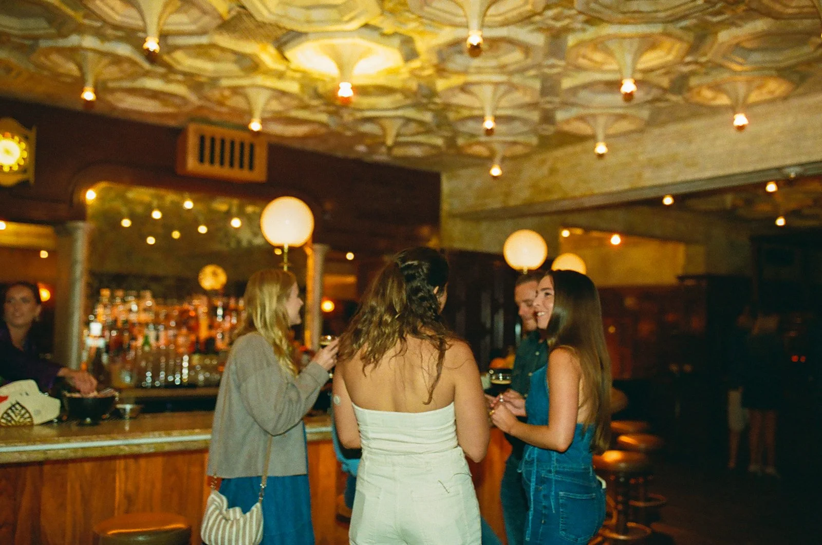 A bride mingling at her wedding welcome party