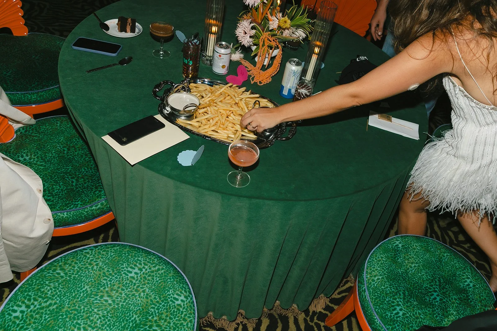A bride eating fries at her wedding reception