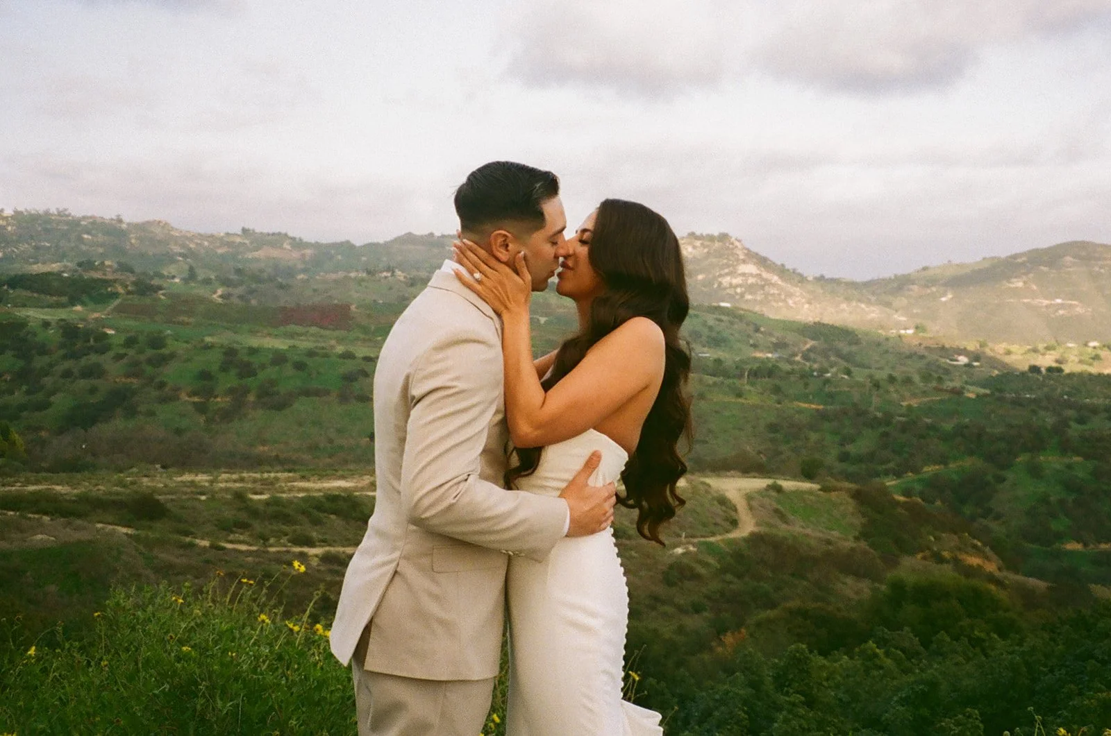 A bride and groom taking pictures at their mountain wedding venue at Tivoli