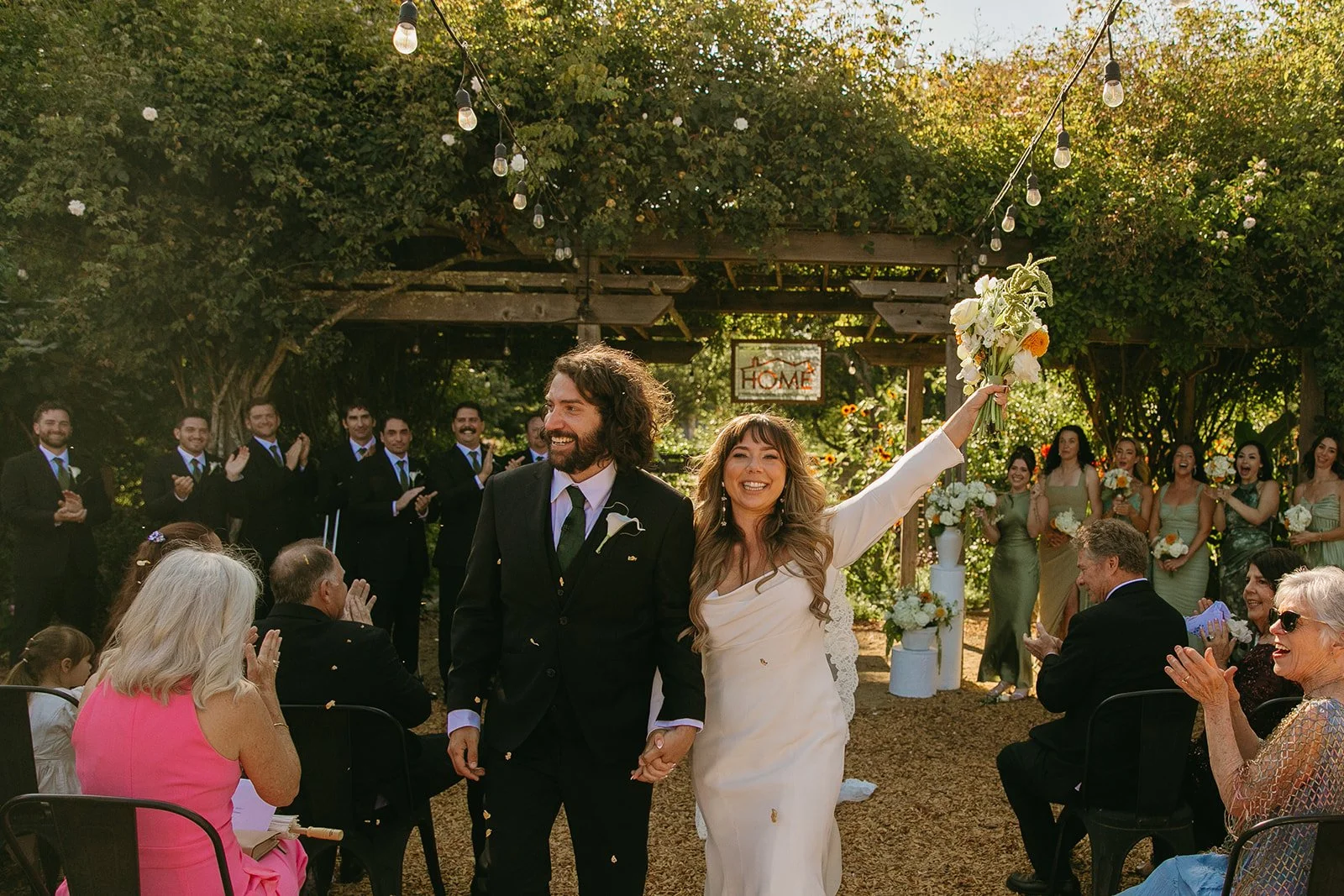A bride and groom cheering after their restaurant wedding ceremony