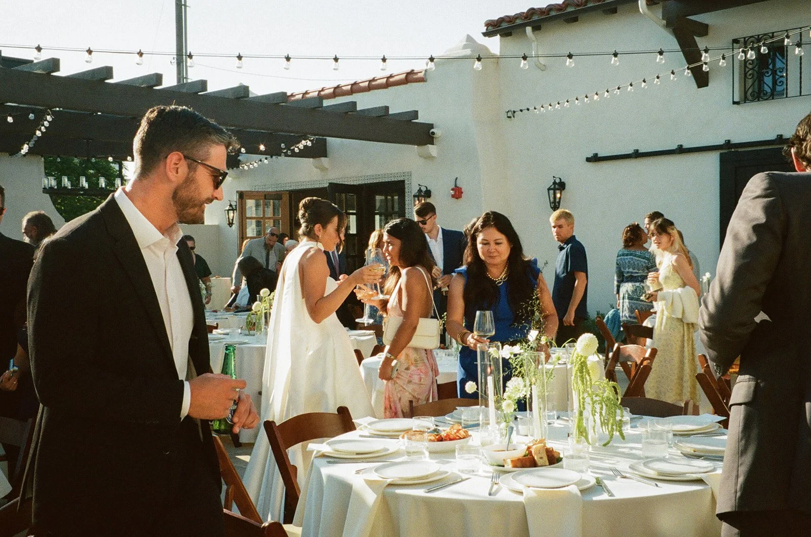 A bride and groom mingling at a wedding recepion