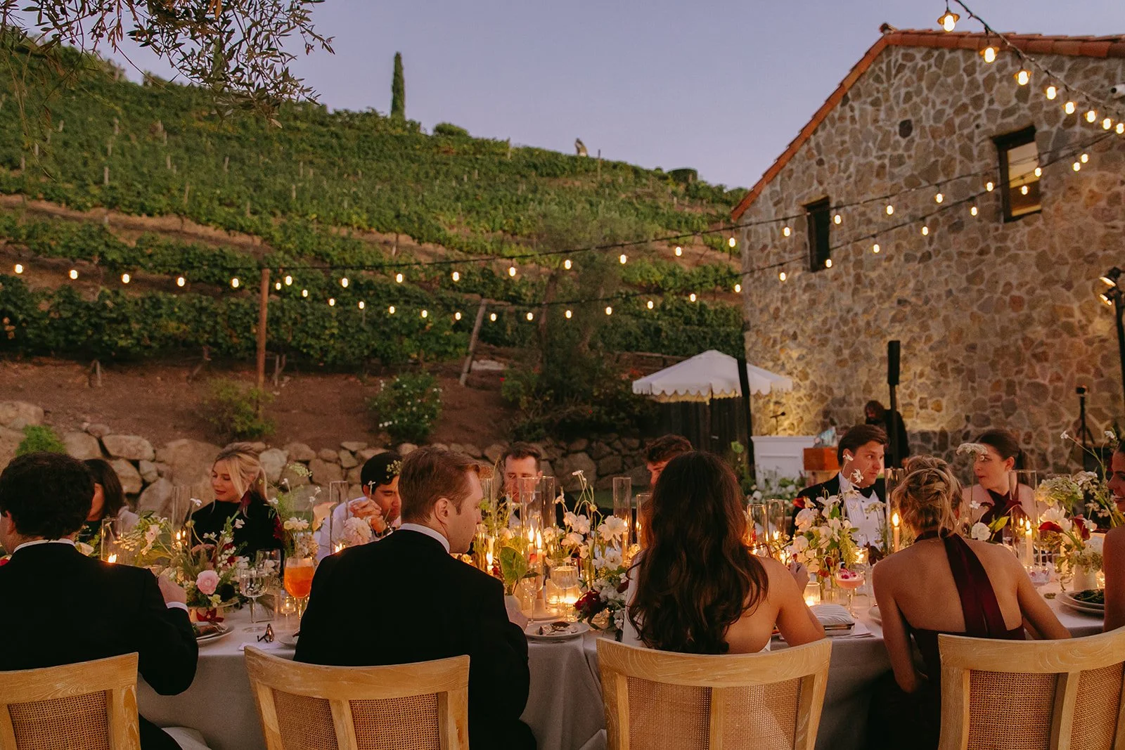 A couple at an outdoor wedding reception at Cielo Farms