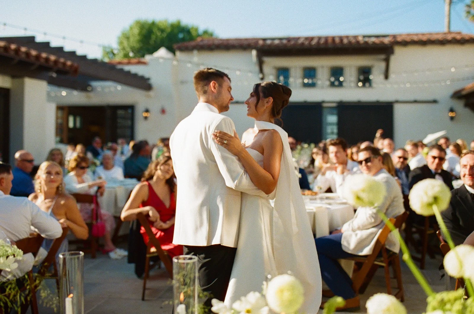 A bride and groom dancing at their wedding reception in SAn Clemente