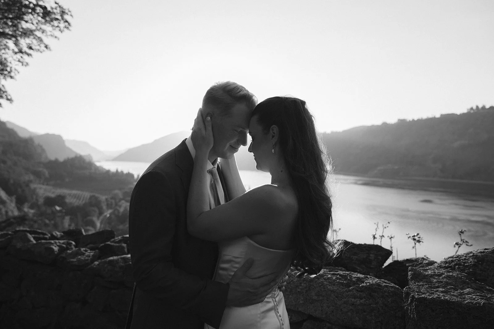 A bride and groom in a black and white wedding photo