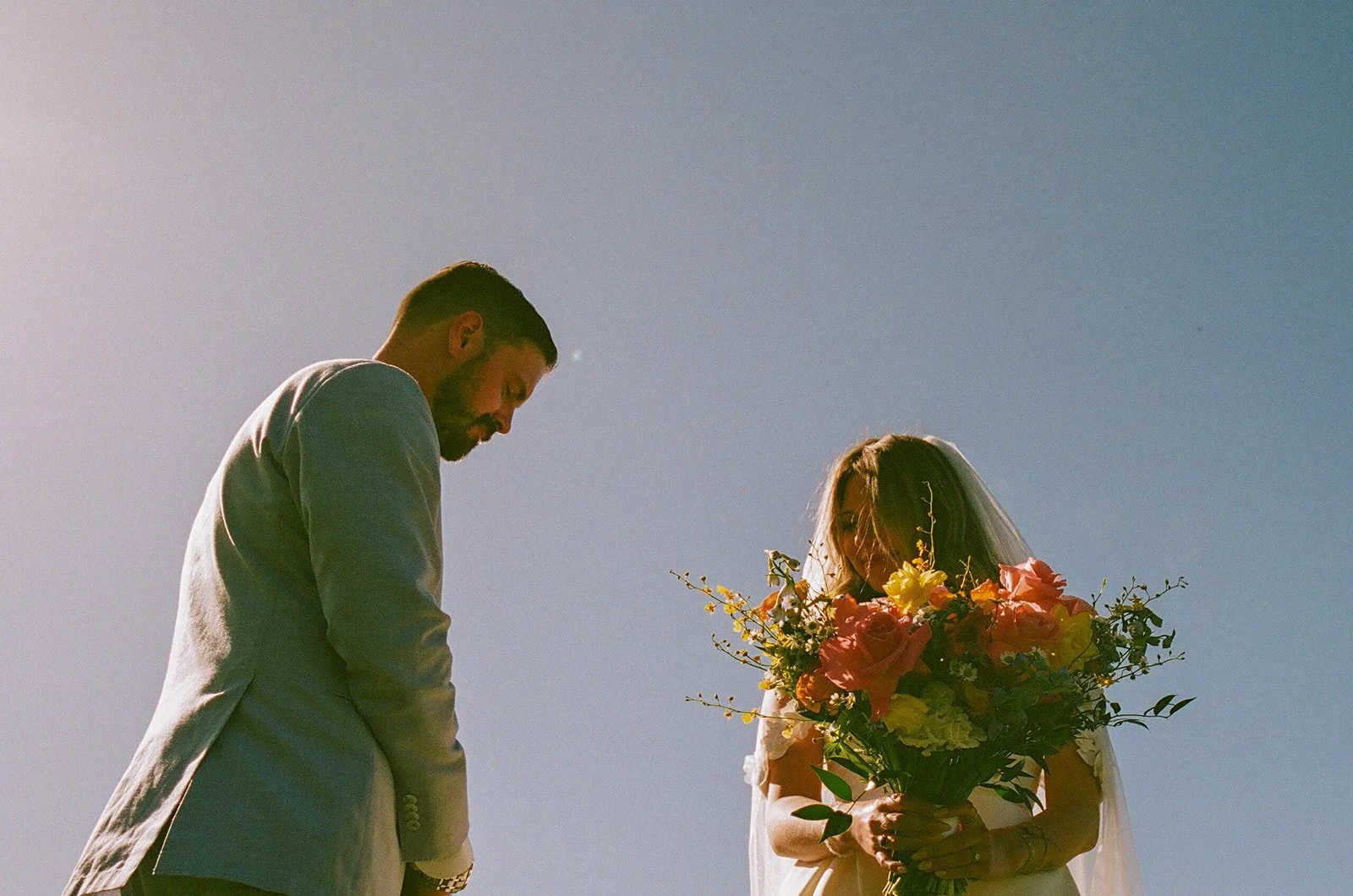 A bride and groom in film wedding photos