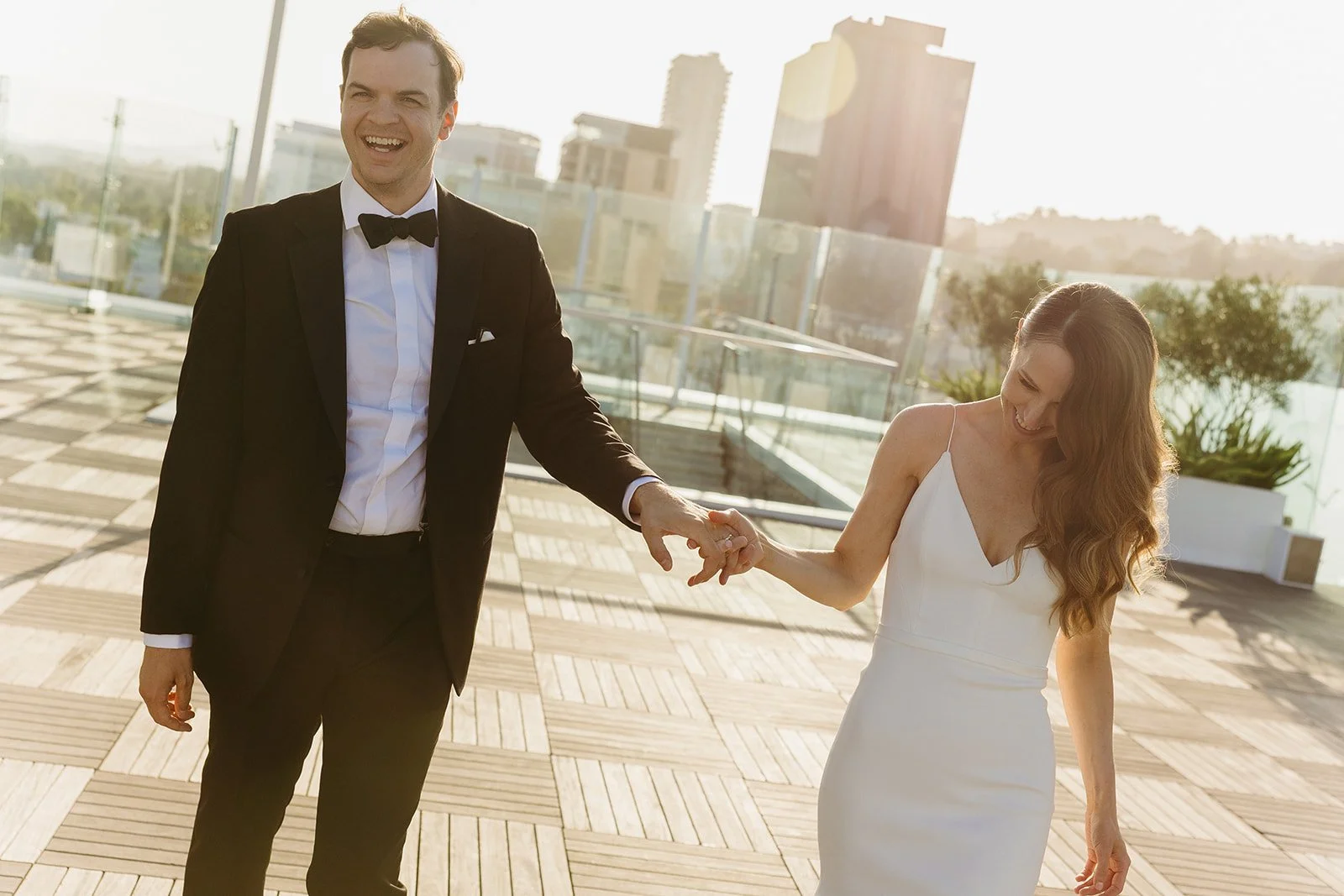 A couple taking wedding photos at their wedding location in Southern California, the London