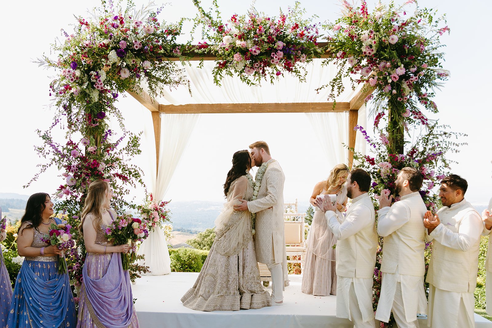 A bride and groom honoring wedding traditions in an Indian wedding ceremony