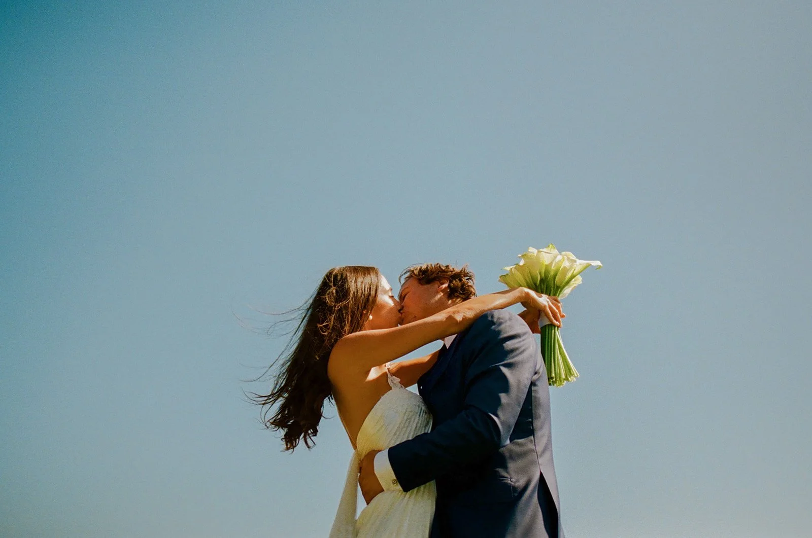 A bride and groom kissing at their malibu sea view estate wedding