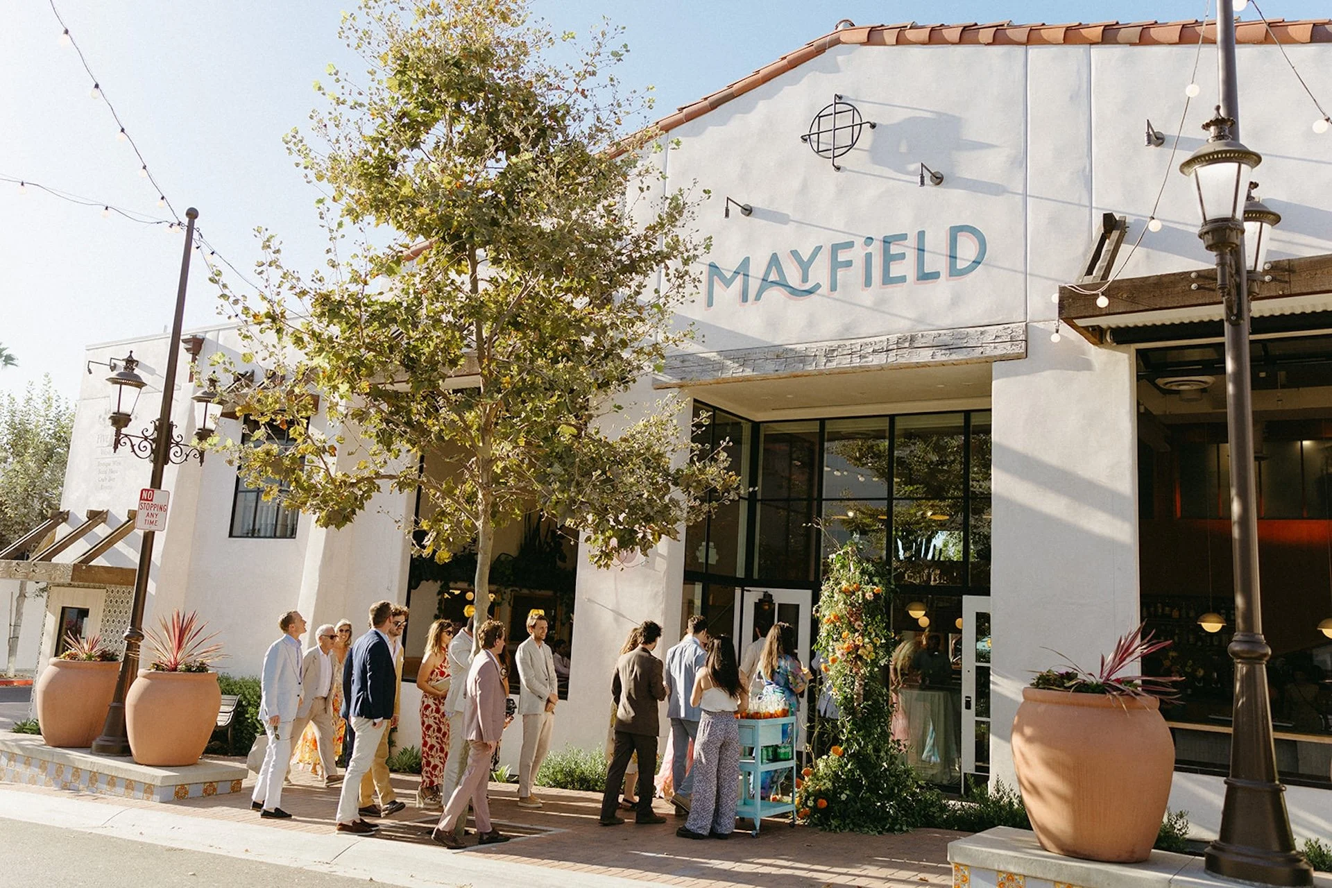 The wedding guests walking into The Mayfield, a restaurant owned by the groom that was also their San Juan Capistrano Wedding Venue