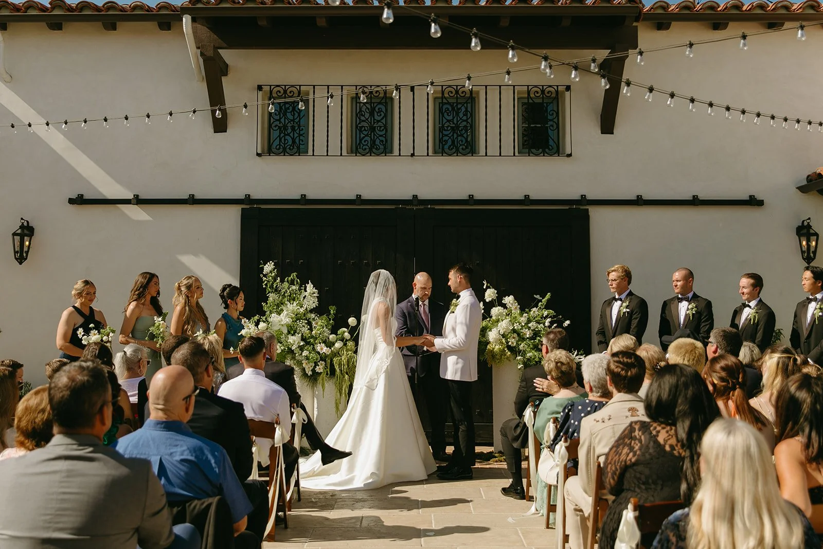 A wedding ceremony at San clemente wedding venue Agape 1928