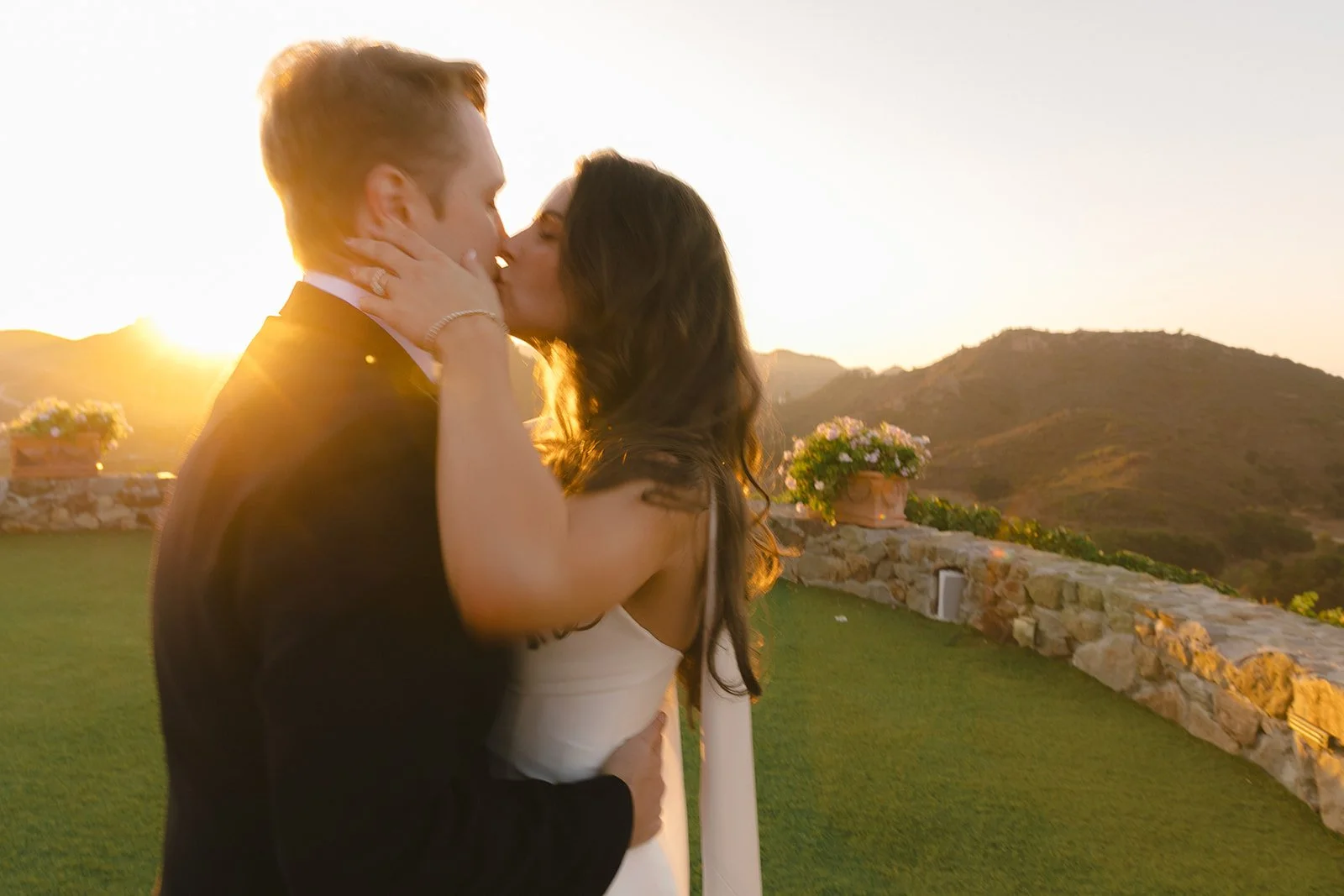 A bride and groom taking sunset wedding photos at Cielo Farms