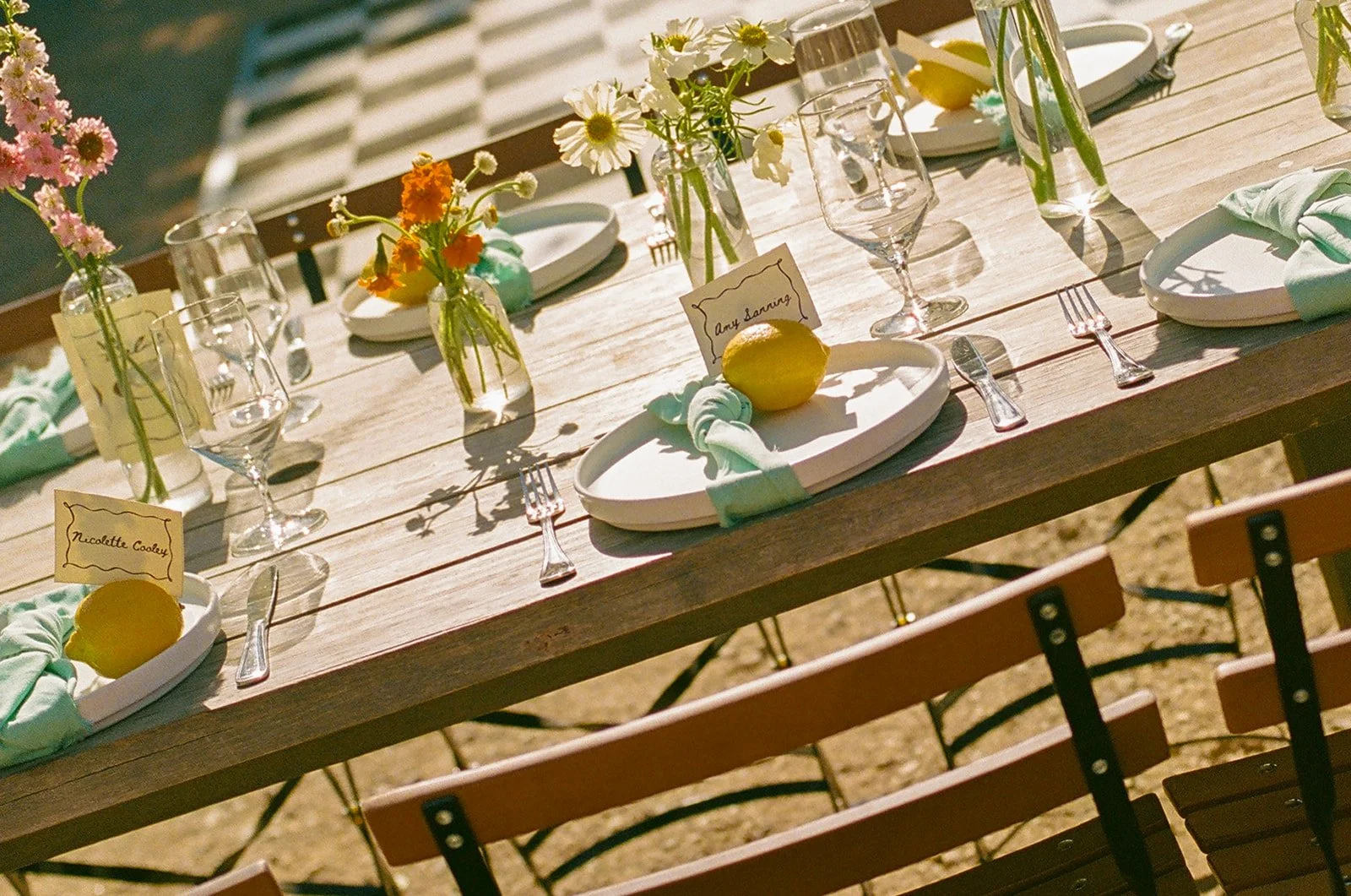 A wedding table setup at an outdoor wedding reception