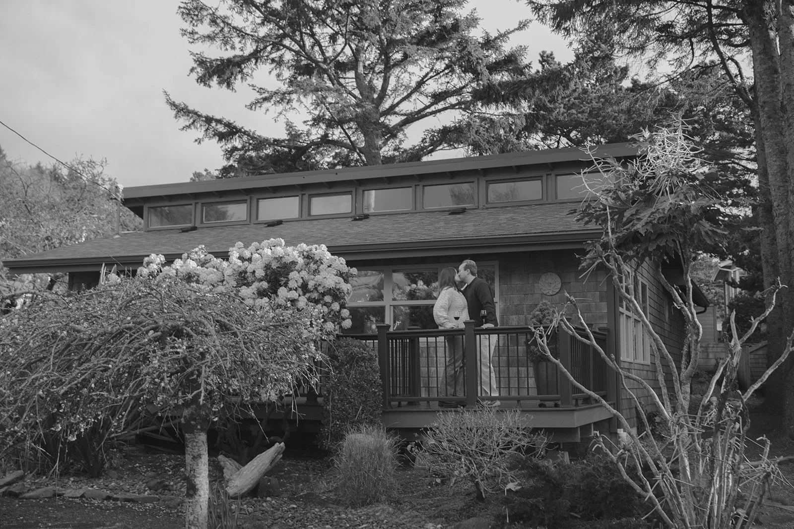 A couple choosing a family home for where to take engagement photos