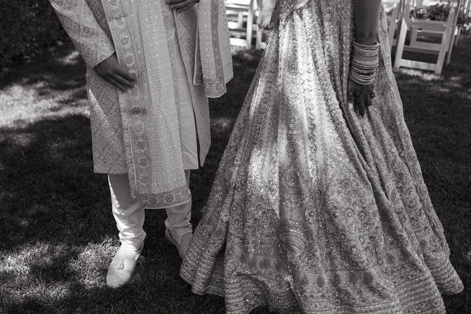 A bride and groom honoring wedding traditions in Indian wedding attire