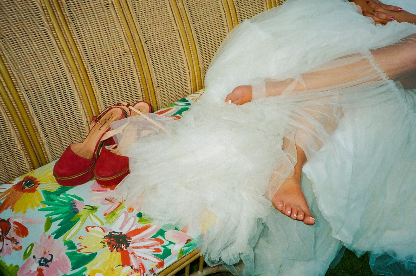 A bride in colorful wedding shoes