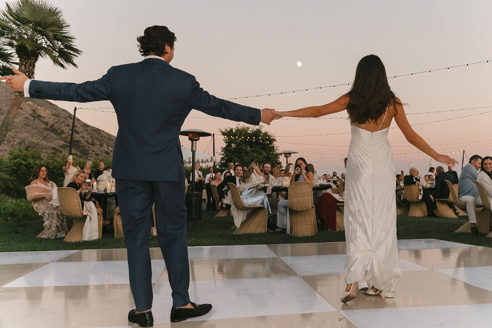 A bride and groom dancing at their wedding reception