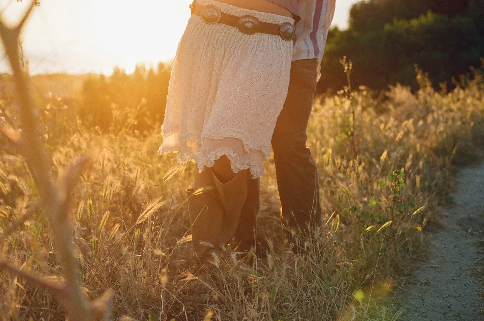 A couple dancing in flower fields for engagement photos in Laguna Beach
