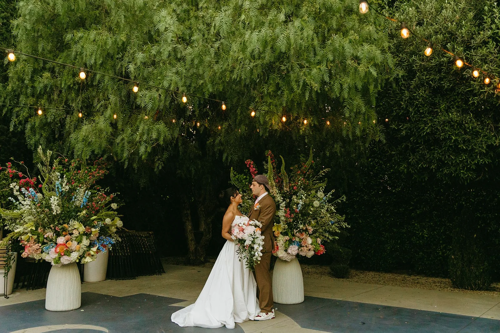 A bride and groom posing for wedding photos