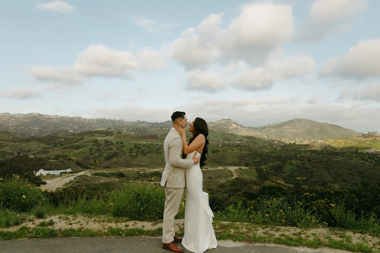 A bride and groom posing for wedding photos at Tivoli, a mountain wedding venue
