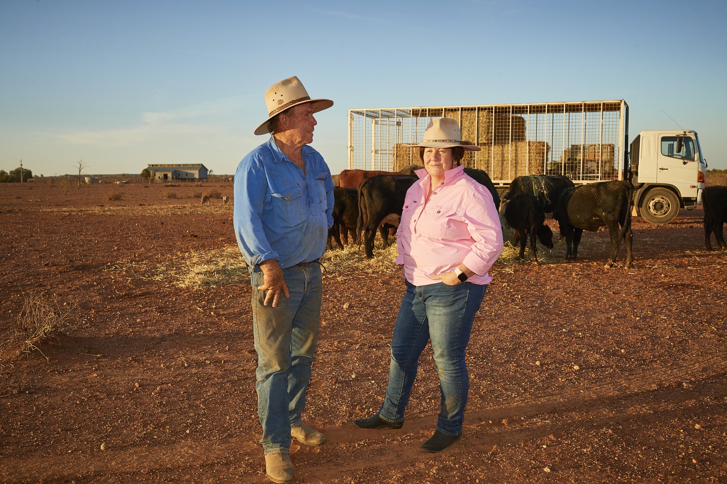 This image shows a farmer and his wife assessing the devastation of a drought on their property in White Cliffs NSW photographed by Steen Vestergaard.  drought, landscape photographer, landscape photography, food production, primary producer, farm ph