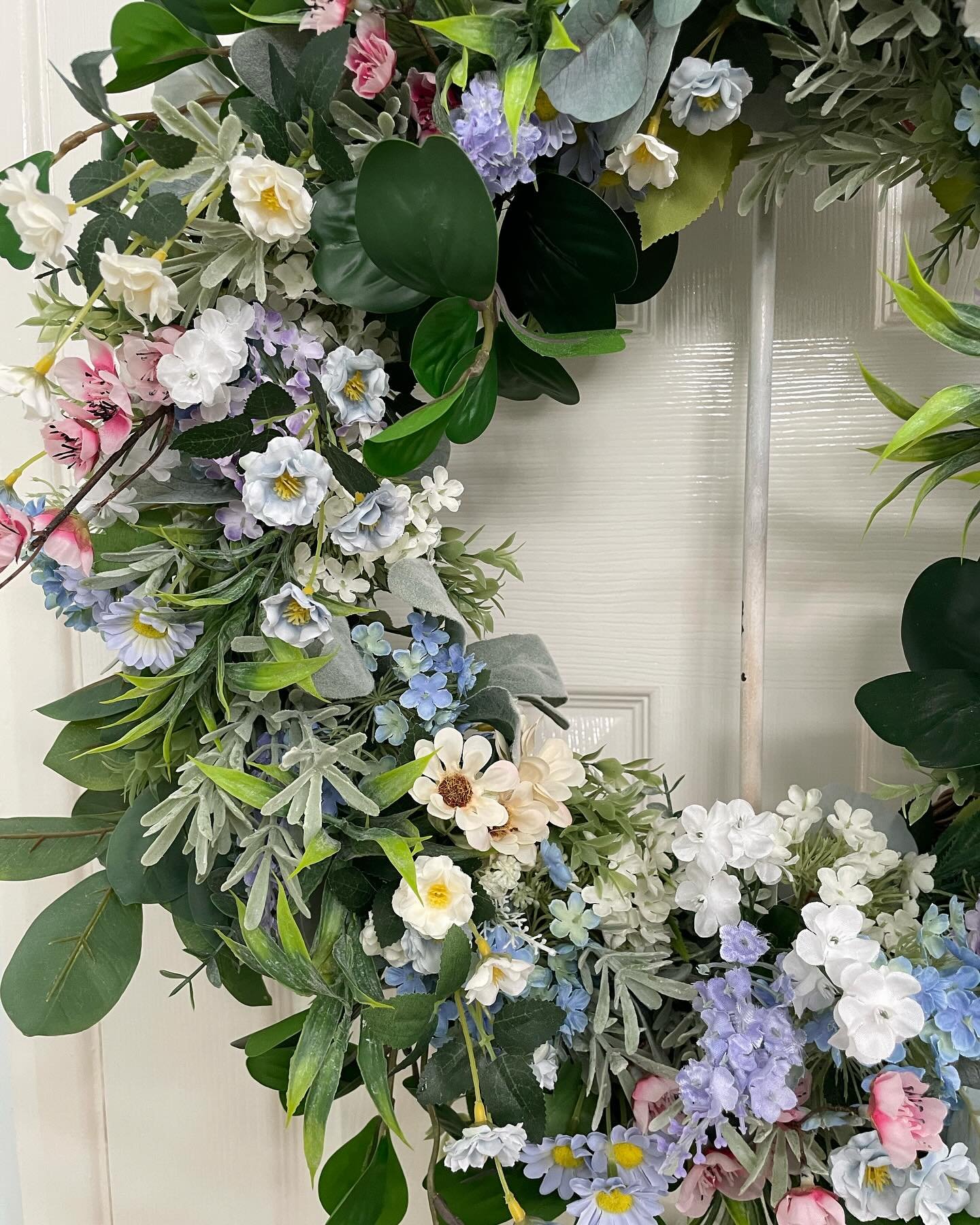 Spring blossom wreath a new design this last week and fast becoming my favourite and I think yours too. I love the delicate cornflower blue flowers and the heart shaped foliage. #springday #spring wreath #springflowers