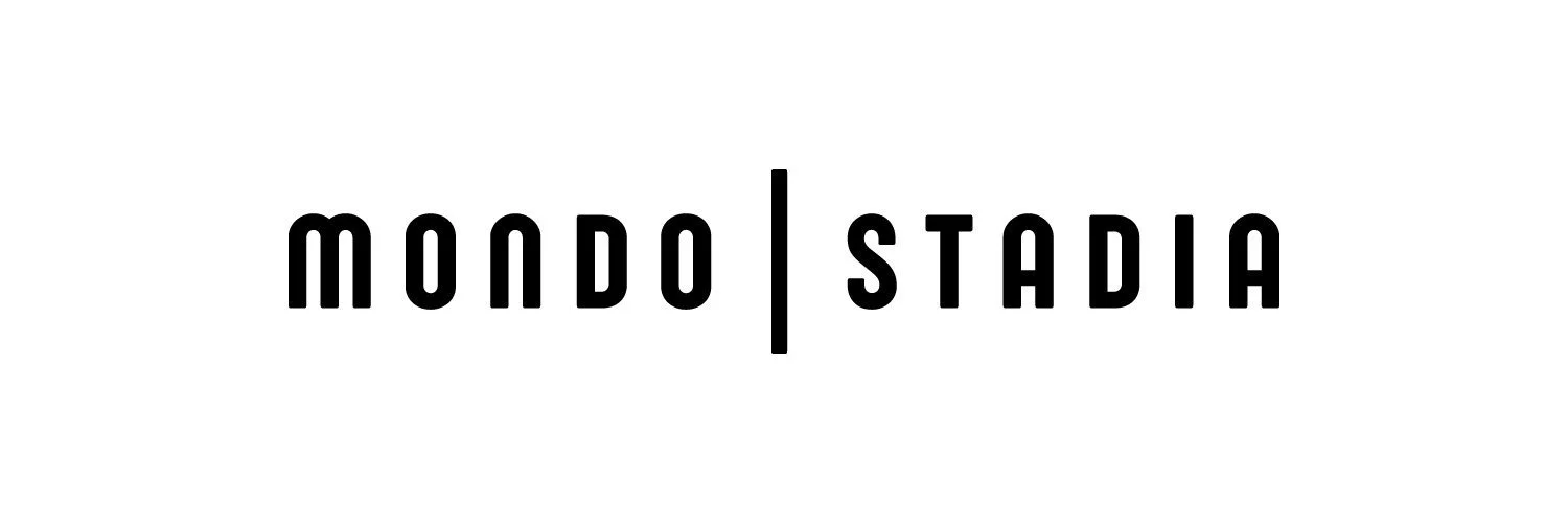 Logo for Mondo Stadium, featuring the words 'Mondo' and 'Stadia' separated by a vertical line, on a white background.