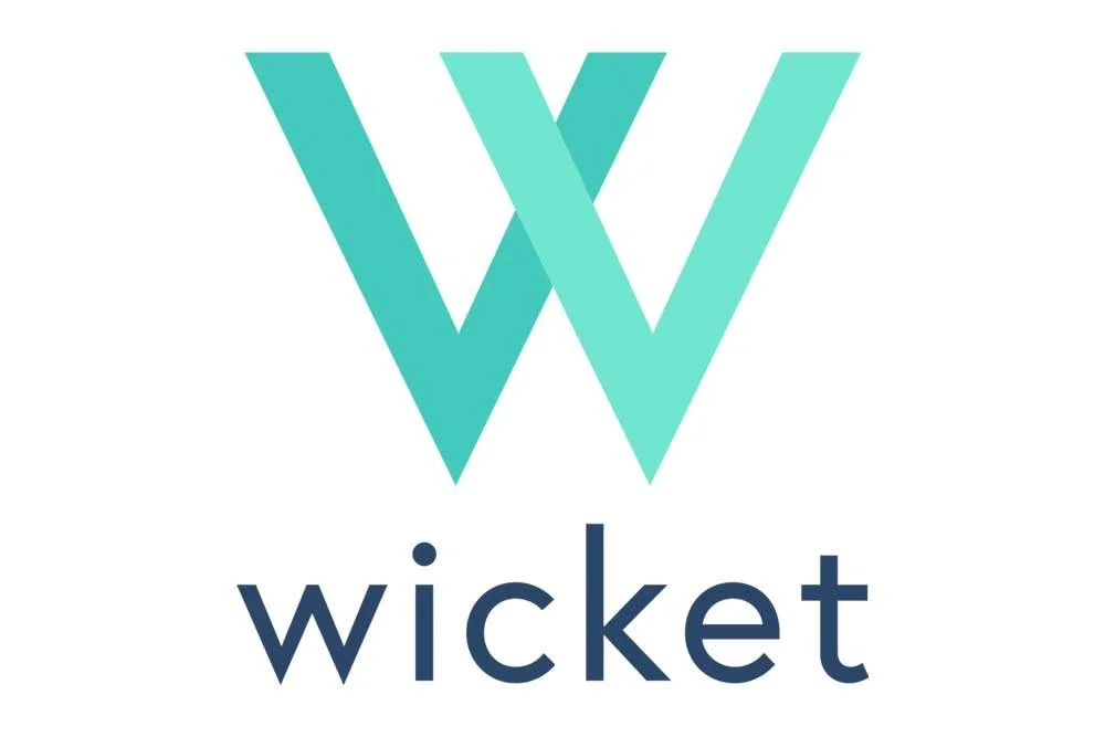 Logo with two overlapping turquoise 'W' letters above the word 'wicket' in lowercase navy blue font.