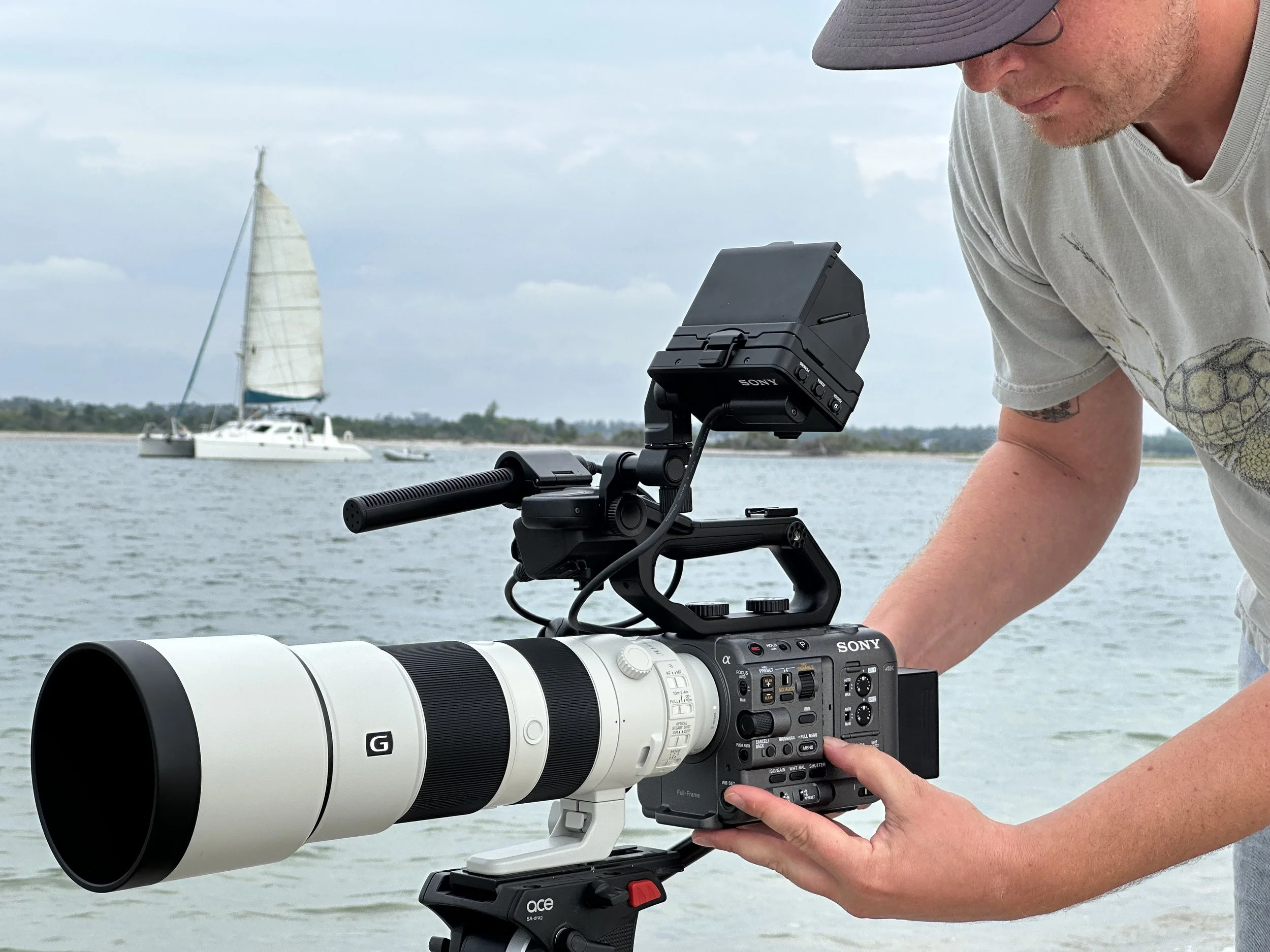 robin on tele with sailboat in BG.jpg