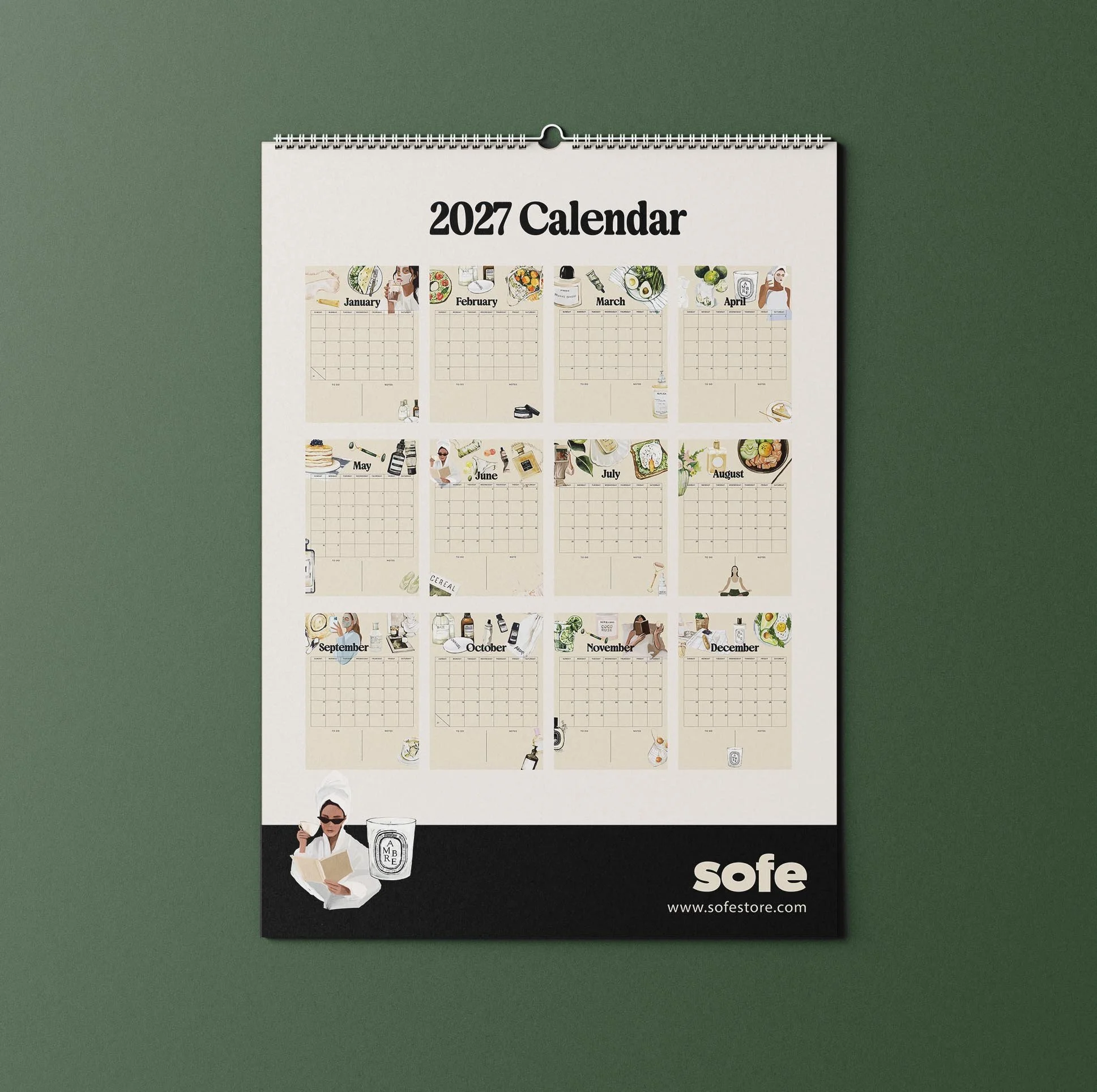 September 2027 page of the Sofe Store wall calendar with a watercolour illustration of a woman in a face mask taking a mirror selfie, a perfume bottle, a straw hat and a date grid with To Do and Notes