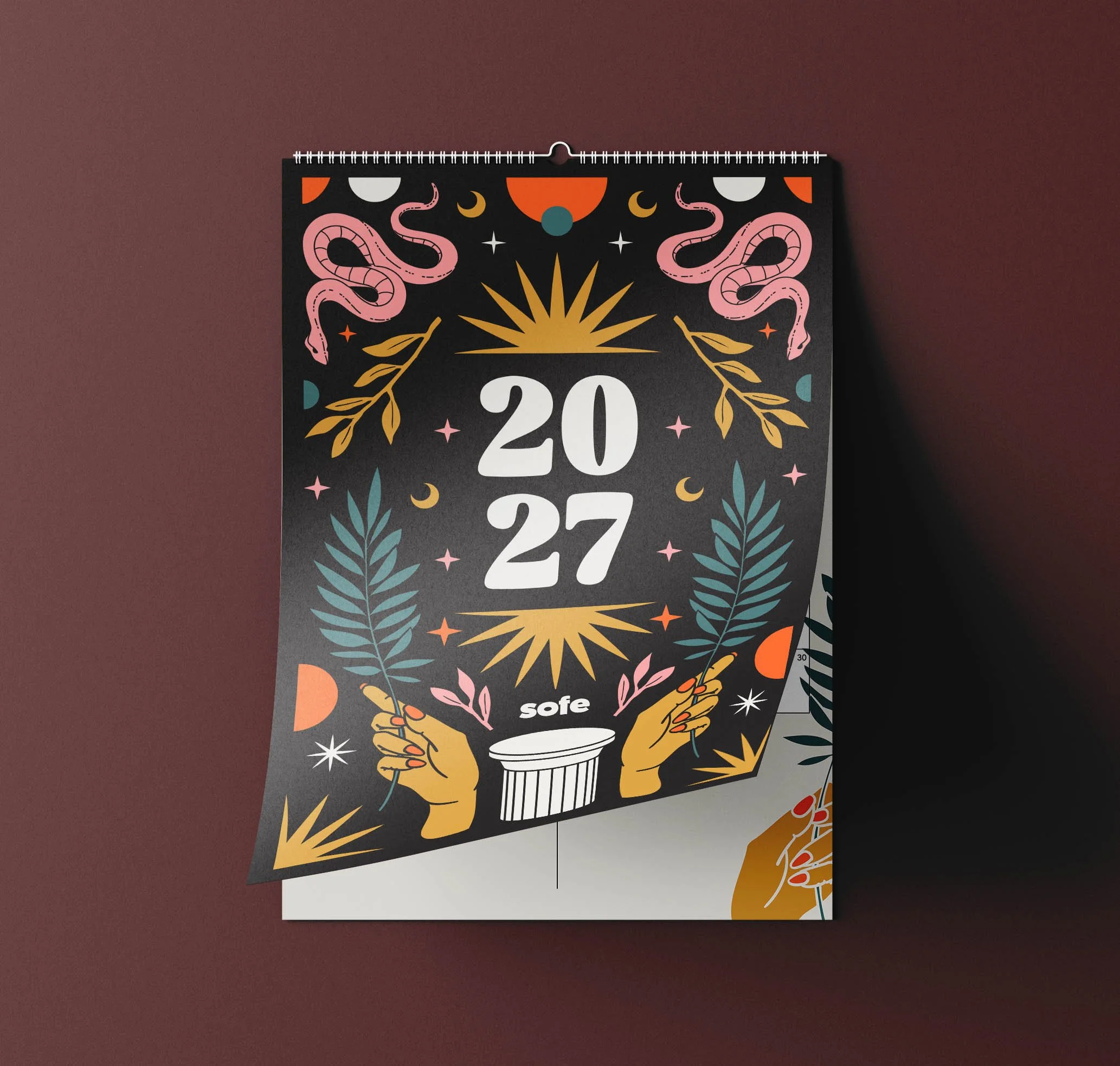 BOHO4.jpgsofe 2027 wall calendar with a black cover illustrated with pink snakes, golden suns, teal palm leaves, hands and a Greek column
