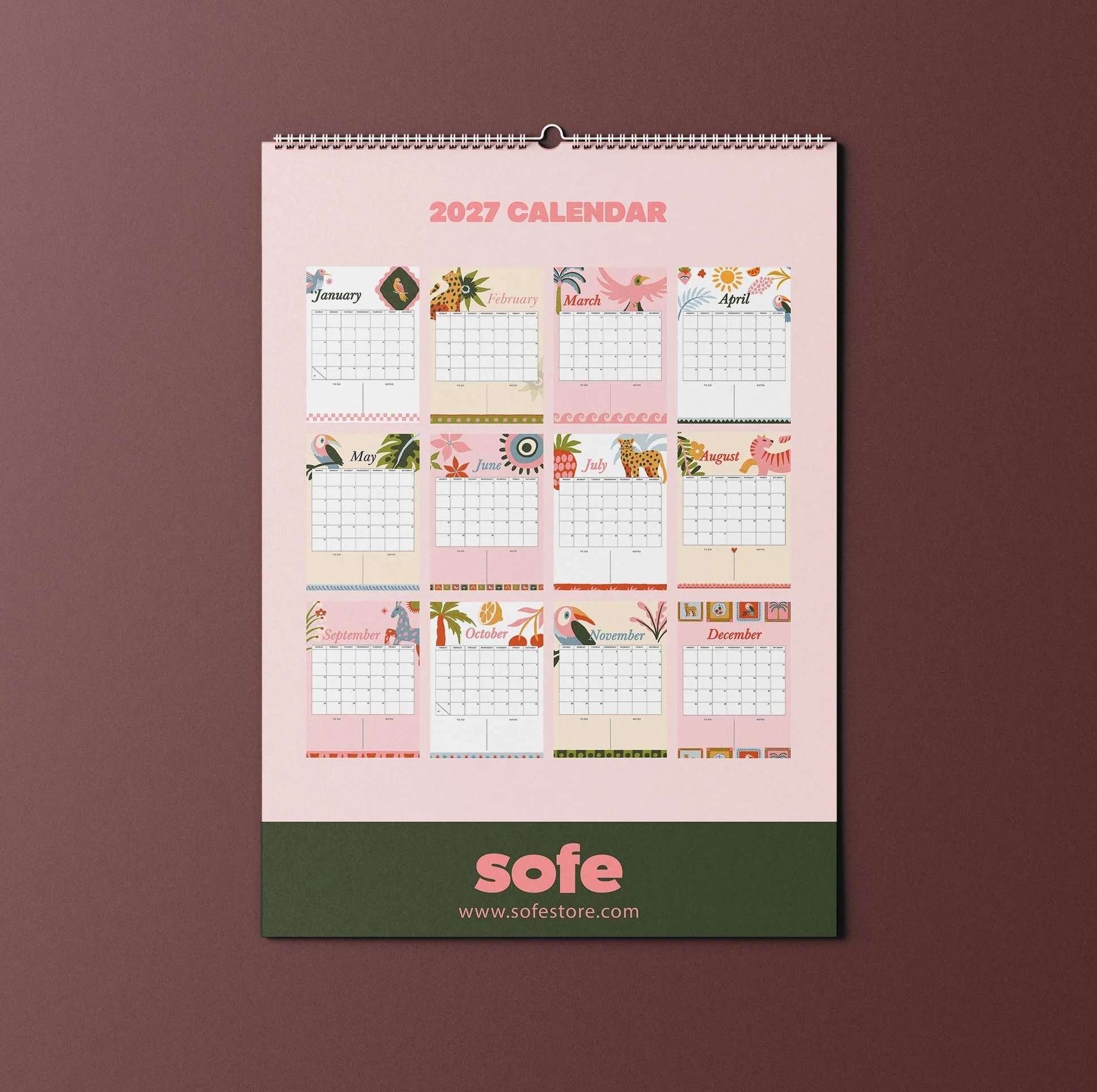 Back page of the Sofe Store 2027 wall calendar on pink, showing a mini preview of all twelve illustrated months above a green band with the Sofe Store logo and sofestore.com