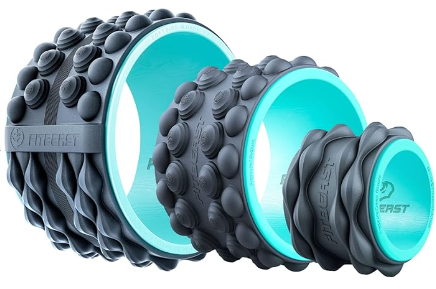 Three black textured massage rollers, with circular and wavy surface patterns, arranged in a row on a white background.