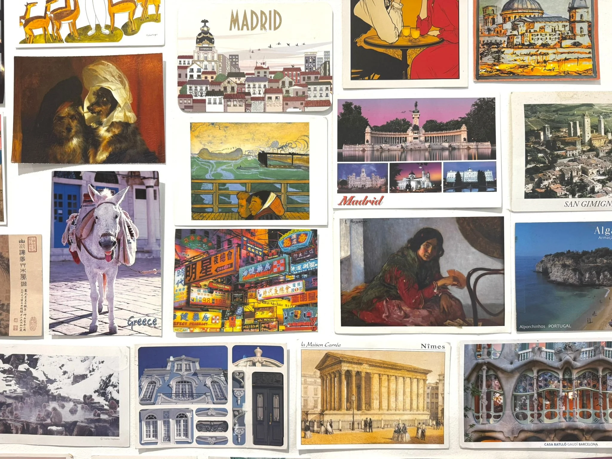 postcard collection on wall