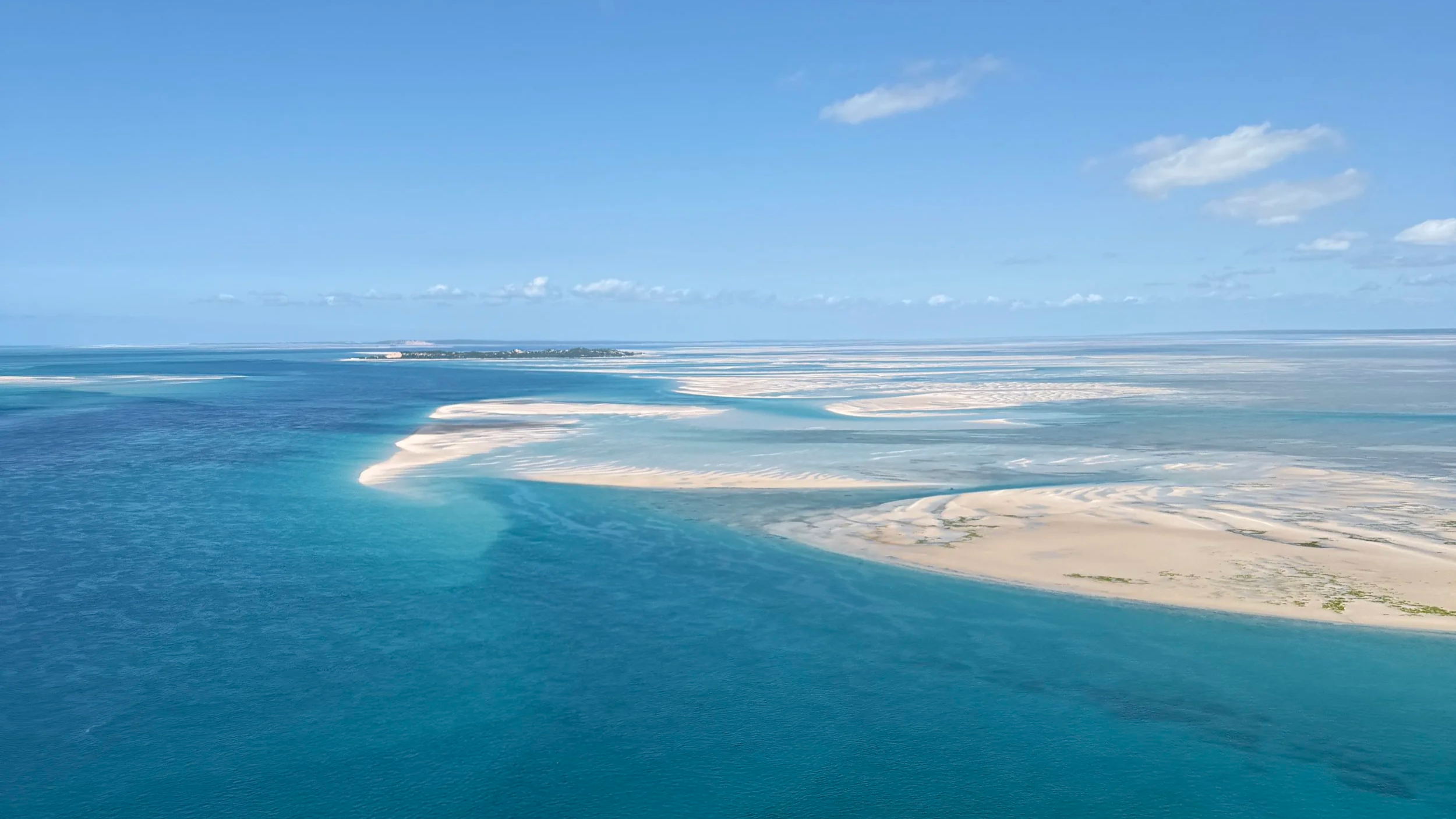 benguerra island vibrant blue sea and sand shoals