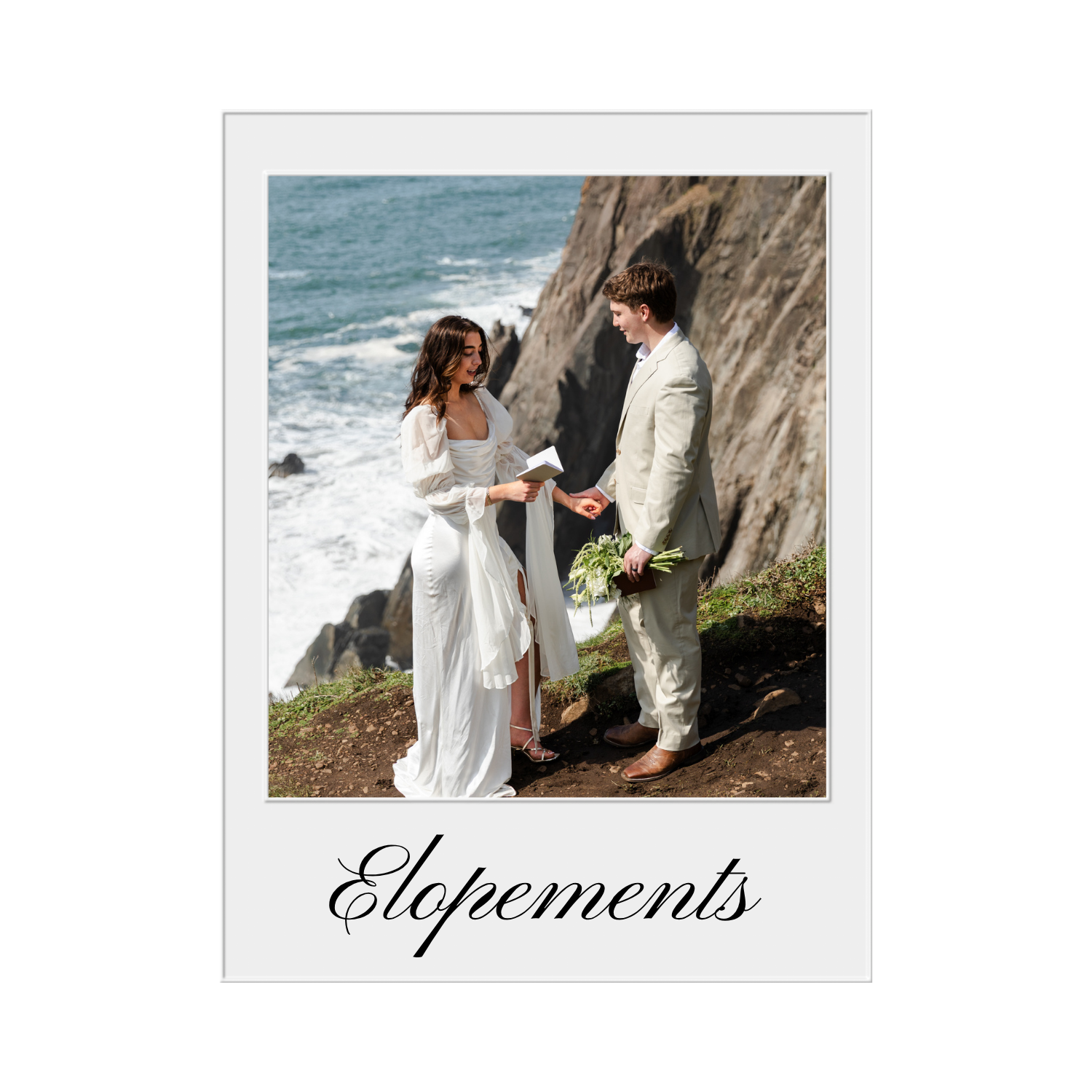 A couple getting married by the ocean, with a rocky cliff in the background, exchanging vows. The bride is in a white dress and the groom is in a light-colored suit, holding a bouquet of flowers. The scene is outdoors on a grassy area near the coastline.