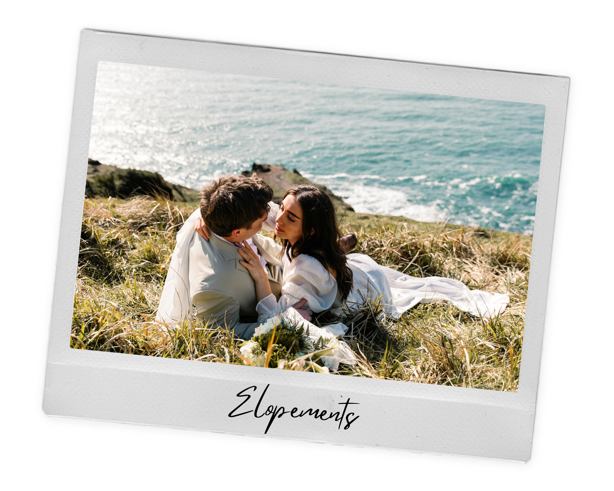 A couple lying on grass by the sea at Elk Flats in Oregon