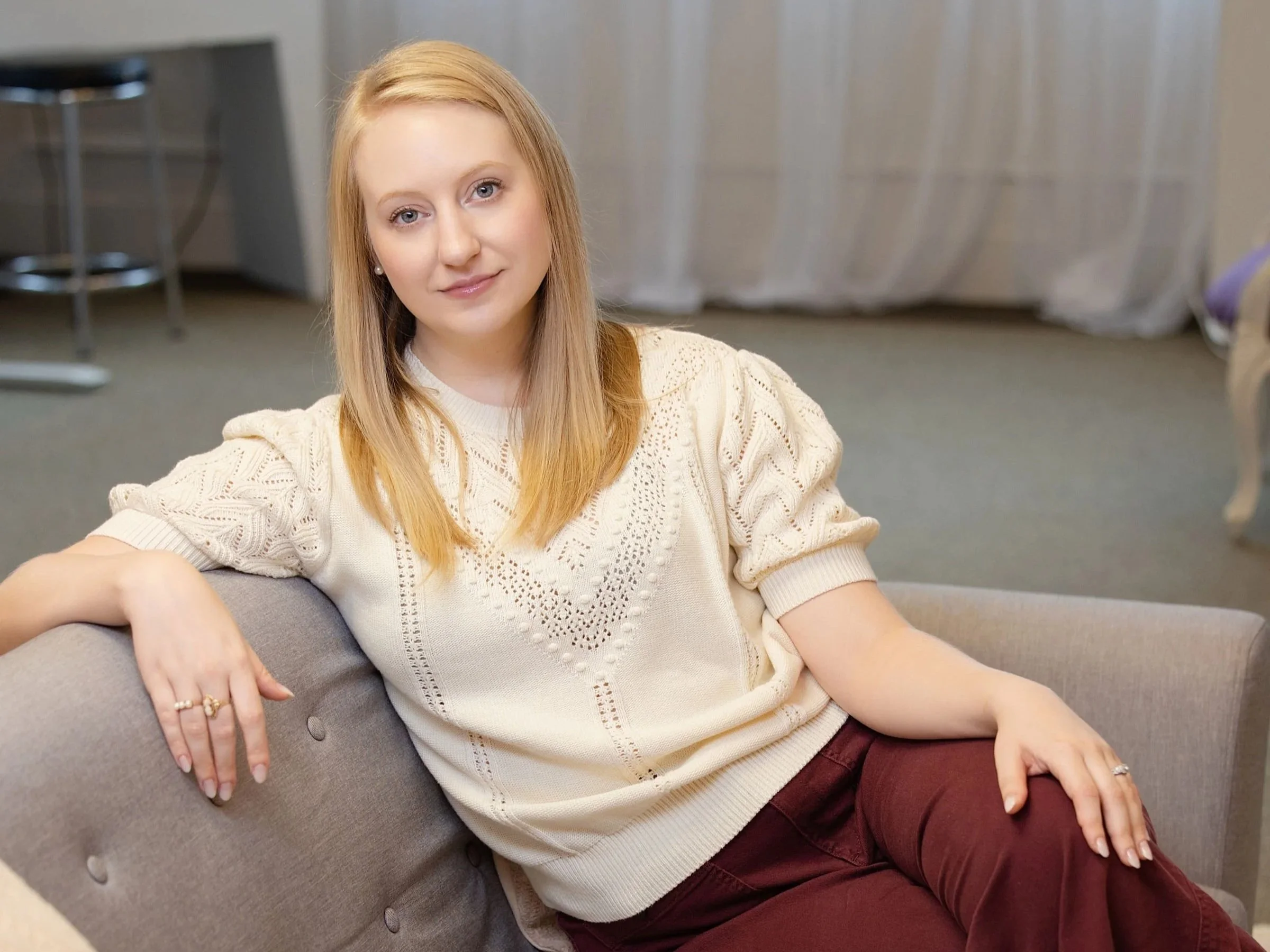 Photo of practice owner in a relaxed position on a couch