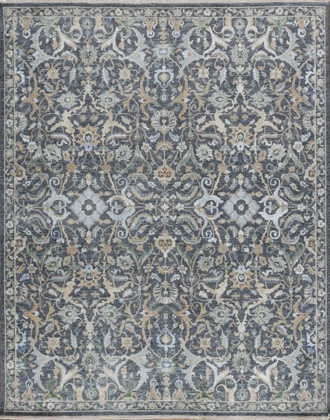 Intricate blue, beige, and green patterned area rug with floral and vine designs.