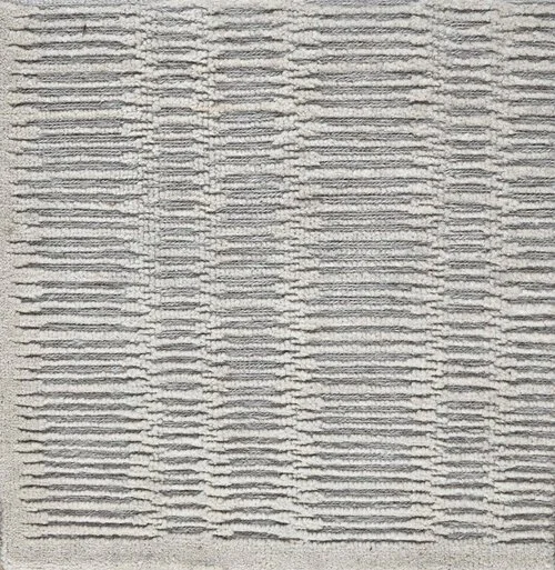 Close-up of a gray textured fabric with horizontal and vertical lines creating a grid pattern.